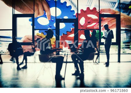 Business team connect pieces of gears. Teamwork, partnership and integration concept. double exposure with light effects 96171860