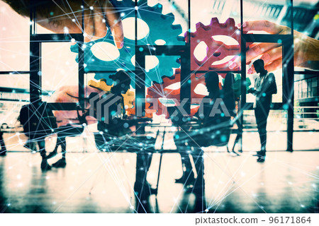 Business team connect pieces of gears. Teamwork, partnership and integration concept. double exposure with network effects 96171864