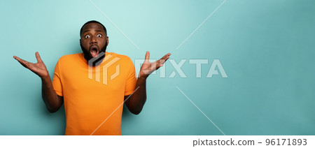 Amazed and shocked expression of a boy over cyan background 96171893