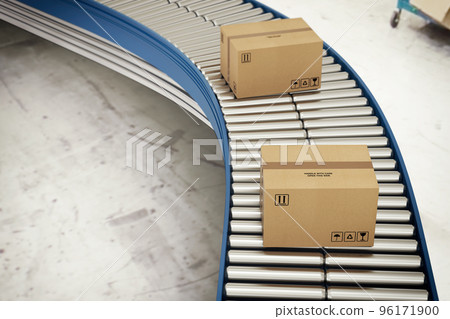 Cardboard boxes on conveyor rollers ready to be shipped by courier for distribution 96171900