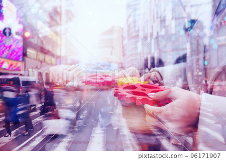 Business team connect pieces of gears. Teamwork, partnership and integration concept. double exposure Business team connect pieces of gears. Teamwork, partnership and integration concept. double exposure 96171907
