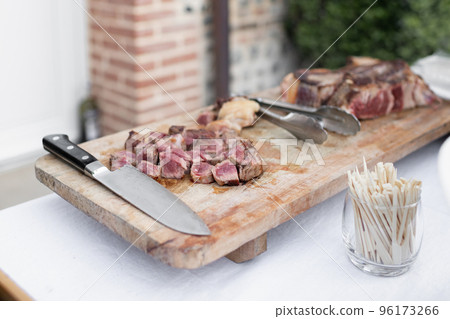 Pieces of pork cooked on a plancha Pieces of pork cooked on a plancha 96173266
