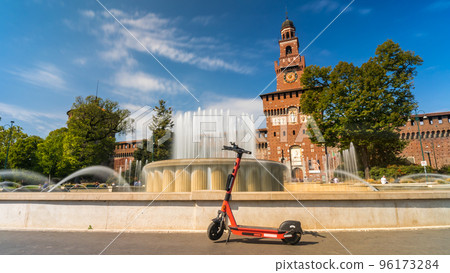 Electric scooter near Castello Sforzesco - Sforza Castle in Milan, Italy. Electric scooter near Castello Sforzesco - Sforza Castle in Milan, Italy. 96173284