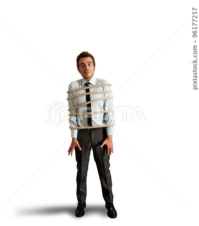 Businessman tied with rope Businessman tied with rope 96177257