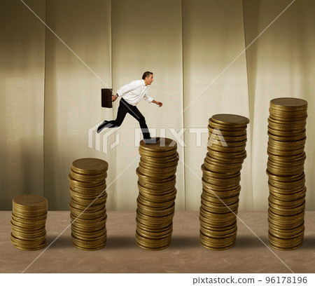 Jumping businessman on money Jumping businessman on money 96178196