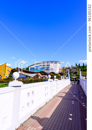 Scenery around Amakusa Ariake Octopus Highway in the background of a beautiful summer sky "Michi-no-Eki Ariake (Ripple Land)" tourist attraction 96180282