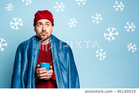Boy caught a cold and drinks hot the. Cyan background. Concept of illness Boy caught a cold and drinks hot the. Cyan background. Concept of illness 96180810