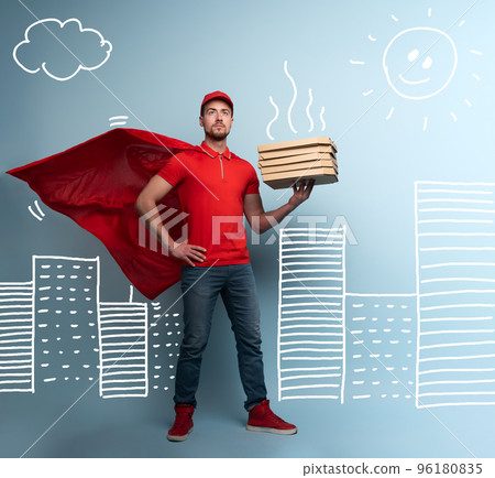Deliveryman with pizzas acts like a powerful superhero. Concept of success and guarantee on shipment. Studio cyan background Deliveryman with pizzas acts like a powerful superhero. Concept of success and guarantee on shipment. Studio cyan background 96180835