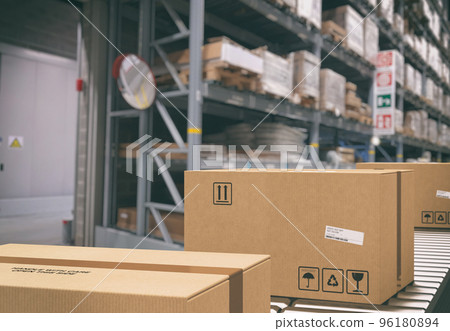 Cardboard boxes on conveyor rollers inside a warehouse ready to be shipped by courier for distribution Cardboard boxes on conveyor rollers inside a warehouse ready to be shipped by courier for distribution 96180894