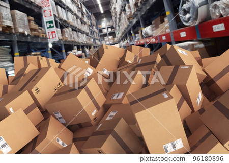 Pile of cartons piled on the ground in a warehouse 96180896