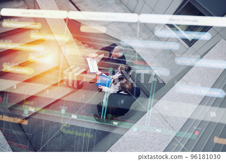 Business people that work together in office. Concept of teamwork and partnership. Double exposure Business people that work together in office. Concept of teamwork and partnership. Double exposure 96181030