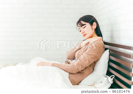 A Japanese woman who suffers from stiff shoulders and creased sleep in the bedroom A Japanese woman who suffers from stiff shoulders and creased sleep in the bedroom 96181474