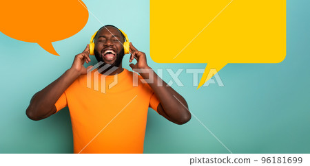 Boy with yellow headset listens to music and dances. emotional and energetic expression. vignette for your text 96181699