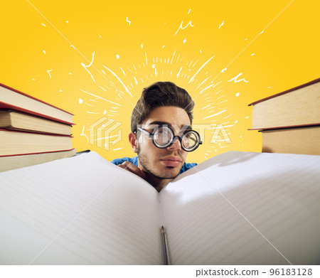 Exhausted student is studying hard on the desk 96183128
