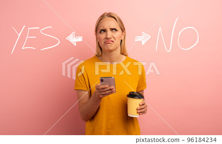 Blonde girl thinks about the right option. Yes or no. Confused and pensive expression. Pink background 96184234