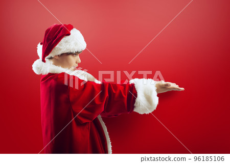 Young boy ready to receive a Christmas present 96185106