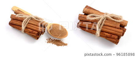 Cinnamon sticks bunch with powder isolated on white background. Top view 96185898