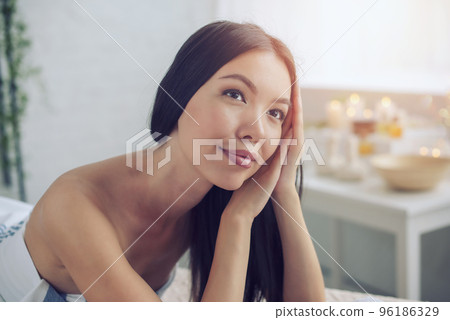 Woman relaxing with a massage in a spa center 96186329