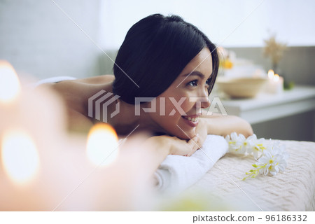 Woman relaxing with a massage in a spa center 96186332