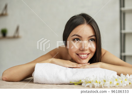 Woman relaxing with a massage in a spa center 96186333