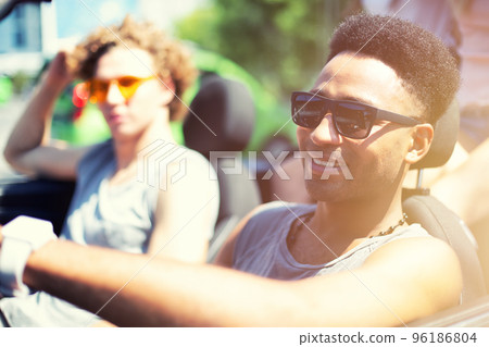 Young friends ready to travel by the car Young friends ready to travel by the car 96186804