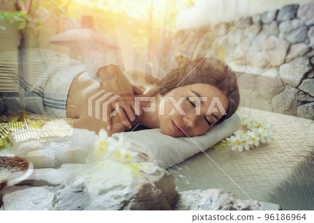 Woman relaxing with a massage in a spa center. Double exposure Woman relaxing with a massage in a spa center. Double exposure 96186964