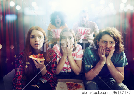 Group of friends watch a film at the cinema Group of friends watch a film at the cinema 96187182