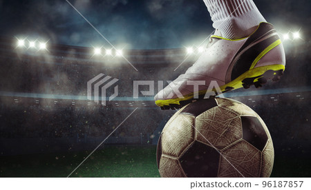 Close up of a soccer striker ready to kicks the ball at the stadium 96187857