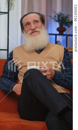 Happy calm senior man smiling dreaming resting, relaxing, good news, feel satisfied at home couch Happy calm senior man smiling dreaming resting, relaxing, good news, feel satisfied at home couch 96188001