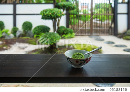 Matcha green tea ice cream eat in traditional Japanese garden 96188156