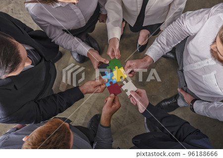 Teamwork of partners. Concept of integration and startup with puzzle pieces. 96188666