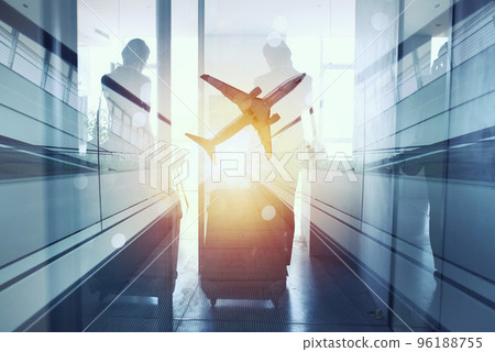 Silhouettes of businessman at the airport who waits for boarding. Double exposure 96188755