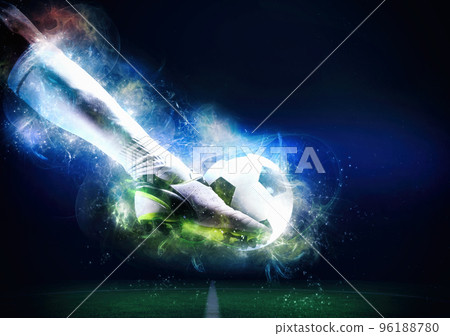 Football scene at night match with player ready to shoot the ball 96188780