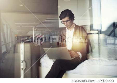 Traveler businessman with his laptop ready to fly. Double exposure 96188823