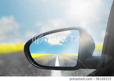 Wing mirror of a car with beautiful panorama reflected 96189335