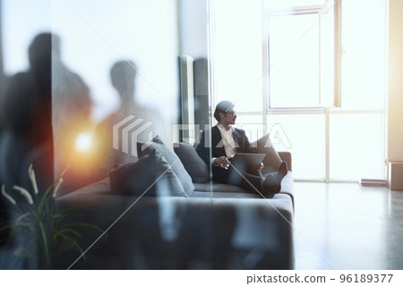 Businessman works with his laptop at home. Double exposure Businessman works with his laptop at home. Double exposure 96189377