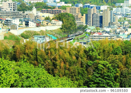 Keio Liner going through the new town of fresh green Keio Liner going through the new town of fresh green 96189380
