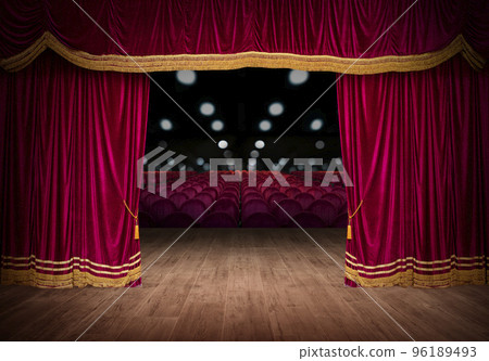 The red curtains are opening for the theater show 96189493