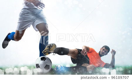 Close up of a football action scene with competing soccer players on white background Close up of a football action scene with competing soccer players on white background 96189707