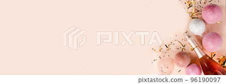 Pink champagne and golden glitter with gift box on a pink background . Banner . The concept of a holiday, New Year, Christmas, birthday, Valentine's Day, Mother's Day. Flat lay with a copy of space.  96190097