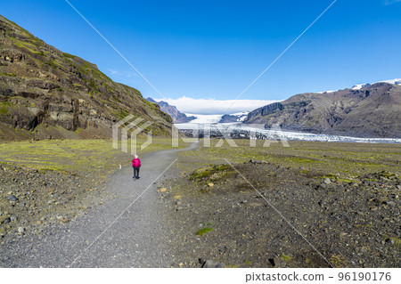 Vatnajokull is the largest and most voluminous ice cap glacier in Iceland. Visitors taking a short trail hikes to the edge of the glacier from visitor center Vatnajokull is the largest and most voluminous ice cap glacier in Iceland. Visitors taking a short trail hikes to the edge of the glacier from visitor center 96190176