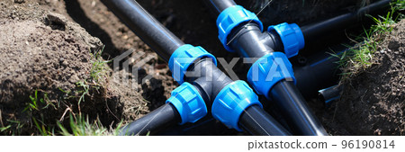 PVC pipeline in garden and black pipes in ground PVC pipeline in garden and black pipes in ground 96190814