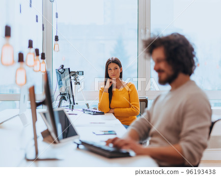 A young woman using a camera to present her business with online clients A young woman using a camera to present her business with online clients 96193438