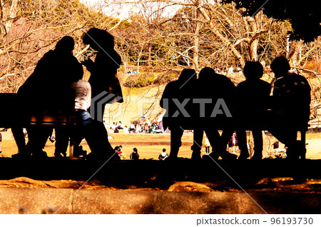 Playing with friends on a park bench on a holiday afternoon is also a snapshot of us. 96193730
