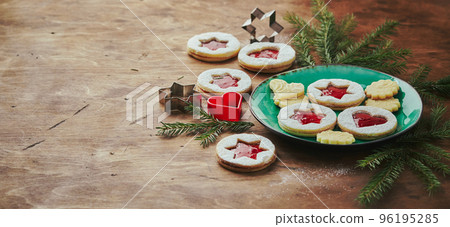 Classic Linzer Christmas Cookies with raspberry or strawberry jam on wooden table Classic Linzer Christmas Cookies with raspberry or strawberry jam on wooden table 96195285