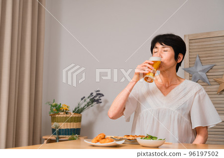 Middle woman who drinks with beer 96197502
