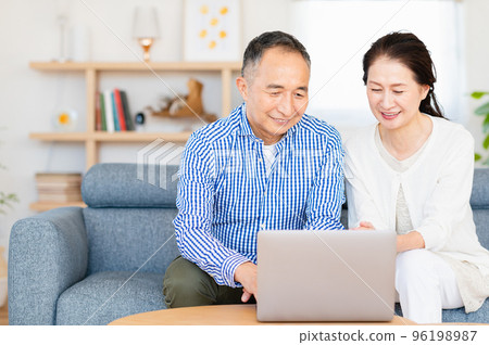 Senior couple using a personal computer Senior couple using a personal computer 96198987