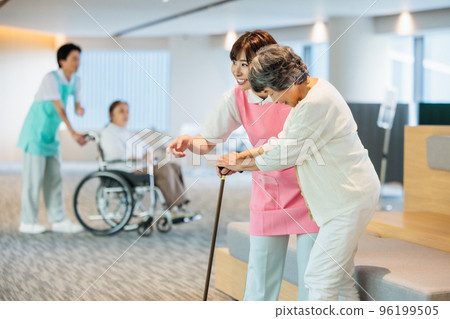 A caregiver who assists walking and an elderly woman Photography cooperation "LINK FOREST" 96199505