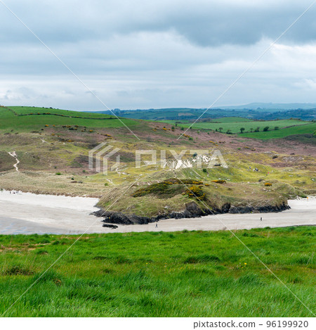 Picturesque hills. Cloudy weather. Landscapes along the Wild Atlantic Way. Nature of Northwestern Europe. Beautiful places of Ireland. Picturesque hills. Cloudy weather. Landscapes along the Wild Atlantic Way. Nature of Northwestern Europe. Beautiful places of Ireland. 96199920
