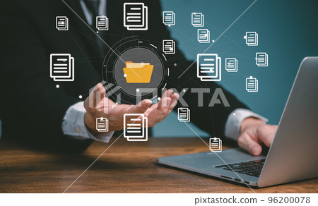 Document management system concept, business man using computer online holding folder and document icon software, searching and managing files online document database, for efficient archiving. 96200078